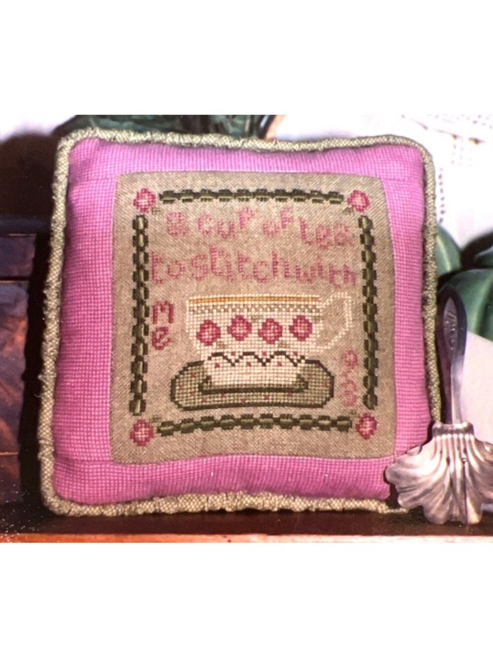 Handmade Cross-Stitch Pillow With Tea-Themed Design Featuring Pink & Green Tones